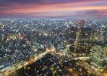 Wireless communication network in Big city in Asia concept. Abstract connection network  on Japan financial district background