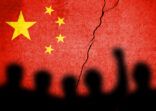 Flag of China painted on a cracked wall. Chinese real estate and debt crisis