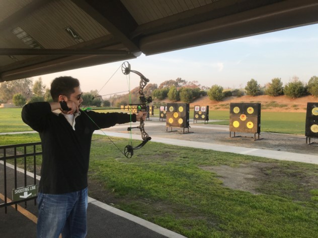 Dr. David Nguyen practicing archery. 