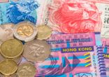 Hong Kong dollar money banknote close-up with coins