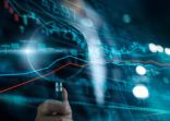 Businessman with magnifying glass search of investing and stock market. Gain and profits with candlestick charts. Stock Market Analysis. Finance data concept.