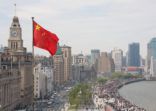 The Bund in Shanghai, China, with Chinese flag