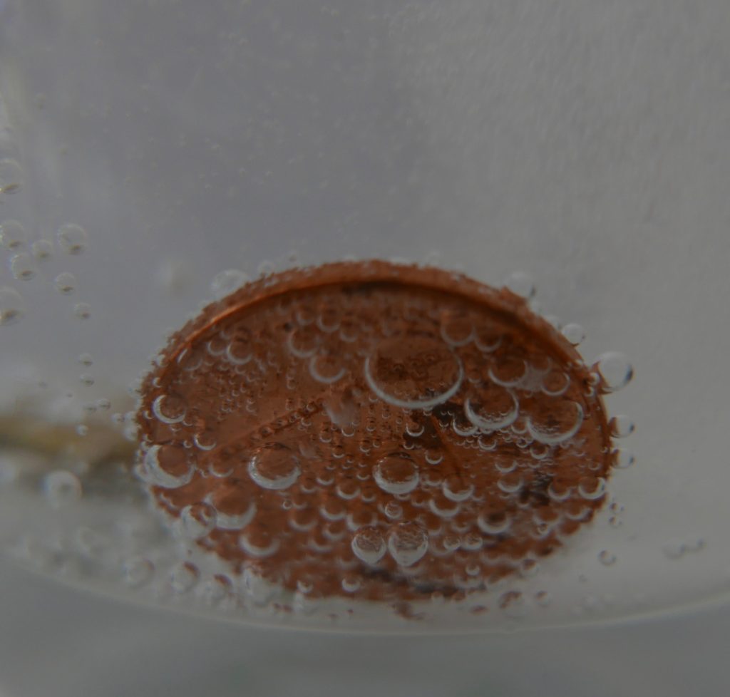 carbon dioxide bubbles on a coin